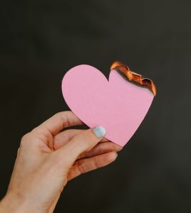 Burning a heart into ashes of disappointment