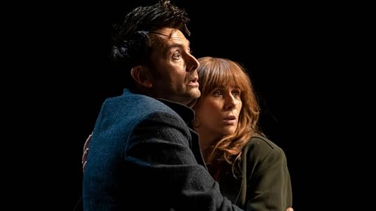 the fourteenth doctor and donna embrace each other in front of a black screen in the star beast doctor who special