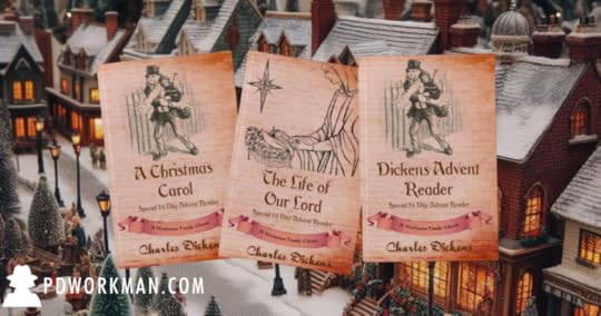 dickens books in front of christmas village