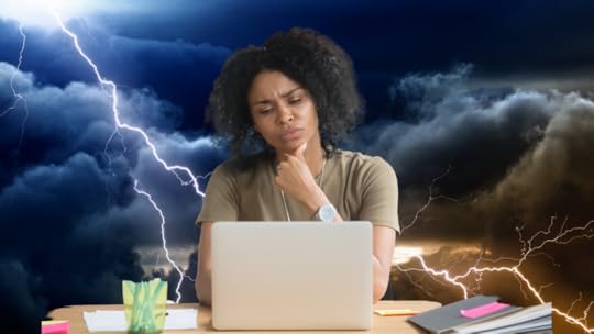 A woman thinking at her laptop.