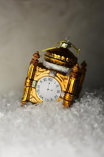 clock ornament in the snow