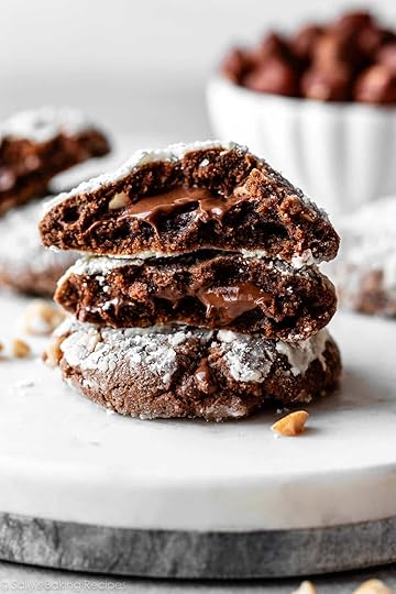 stack of Nutella crinkle cookies with gooey Nutella in the center.