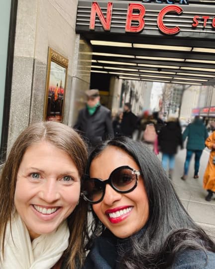 Amy Julia and Niro Feliciano post for a selfie on the sidewalk in front of NBC studios
