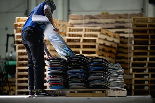man with snowboards for Re-Up Tech process