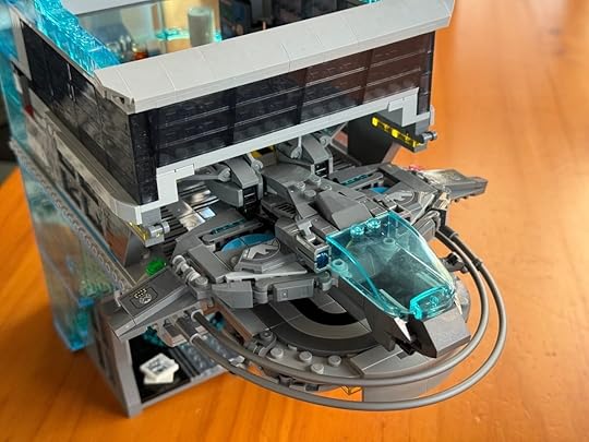 A small LEGO Quinjet on a launchpad