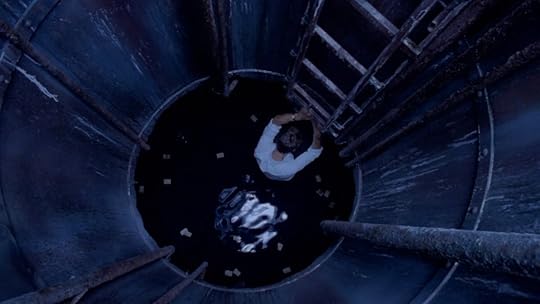 A person climbs down the long ladder into a sewer pit in the Italian horror movie The Sect.