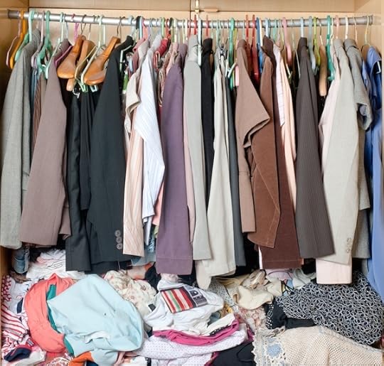 Pile of messy clothes in closet. 