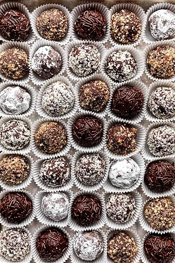 overhead close-up shot of rum balls coated in various toppings.