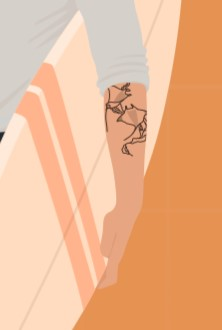 A man holding a surfboard with a tattoo on his arm