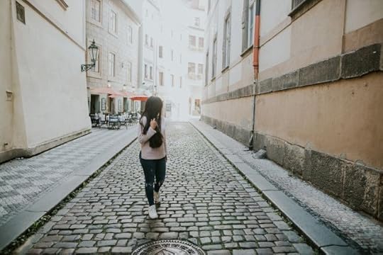 woman on a narrow cobblestone path. Mindfulness