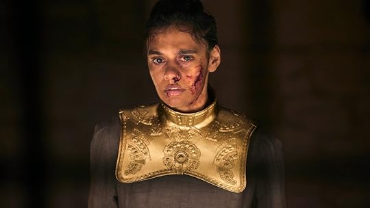Egwene as a collared damane, bloodied and bruised on a dark background