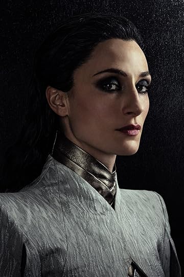 A portrait of Natasha O'Keeffe on a dark background