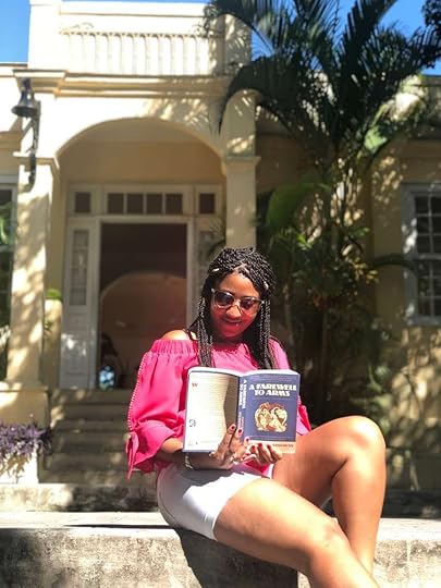 Trenise at Ernest Hemingway's House in Havana, Cuba, and as you'll see, she's reading A Farewell to Arms. You will always find her with a book in her hand -- or on her phone as an audiobook for when she's driving or traveling -- and that includes taking books on vacation! Photo Credit © Trenise Ferreira