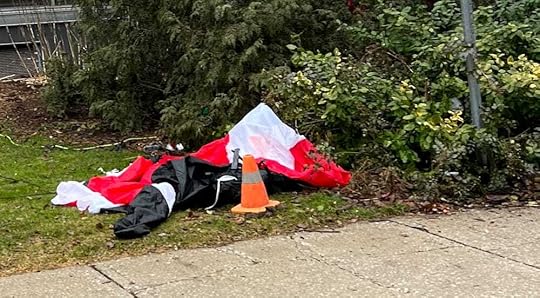 Deflated Santa beside orange cone