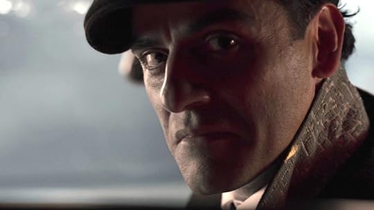 Jake Lockley sneers while in a limo driver's seat and while wearing a hat on Moon Knight
