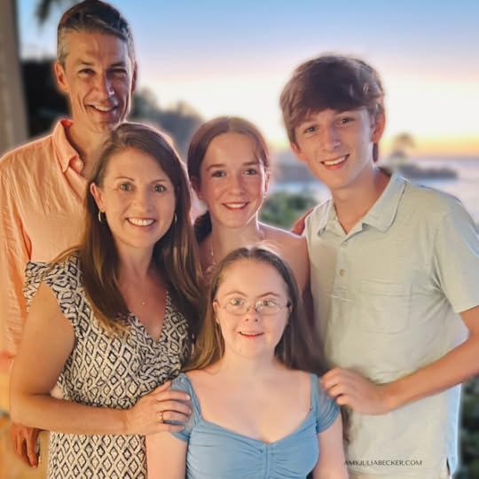 Becker family standing in front of a sunset