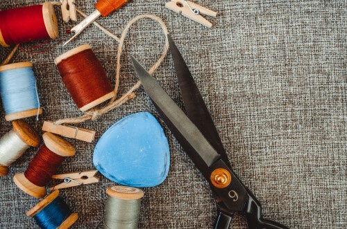 tailor's tools including chalk, threads and shears