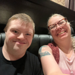 Marcus and Mardra Sikora smiling for selfie.