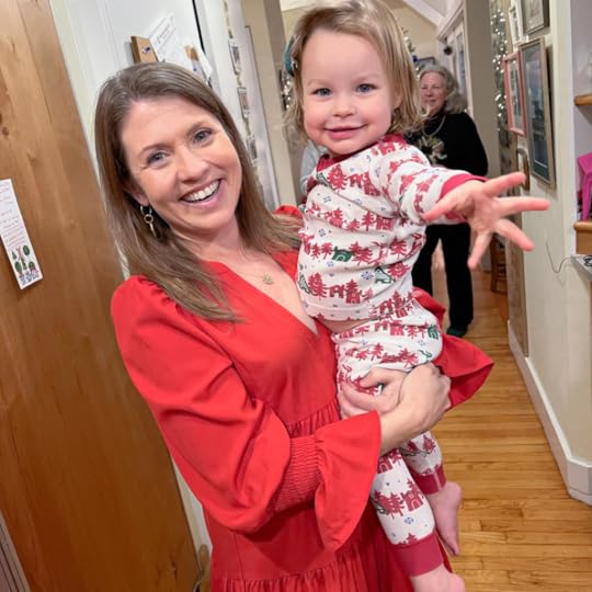 Amy Julia holding a niece and smiling