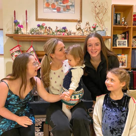 group of family dressed up and smiling