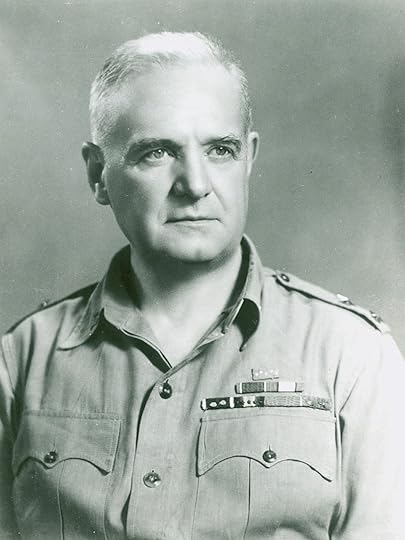 A patch with a red background and blue stylized waves at the bottom. Over the top are two golden tridents crossed in the shape on an x. A gold border lines the patch.