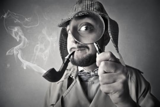 Image: black and white photo of a man dressed as a detective, wearing a trench coat and deerstalker hat, smoking a pipe, and looking at the viewer through a magnifying glass.