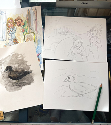 photo of sketches in various stages of completion during Illustrator Joshua Wichterich process