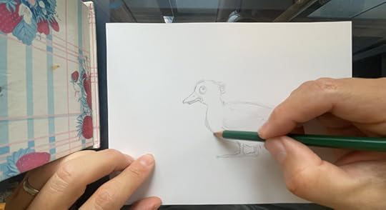 Joshua Wichterich works on a rough sketch of an initial concept of the duck for the book There's a Duck in the House by Don M. Winn.
