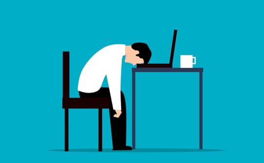 the busy badge of honour worker slumped over a desk