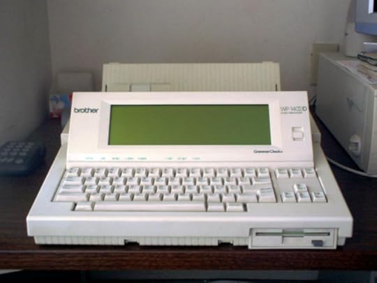 A Brother word processor machine from the 1990s with a narrow green screen and floppy disc drive