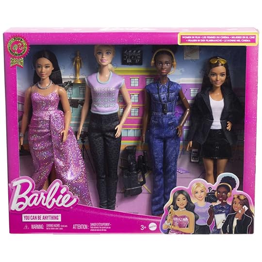 Four different Barbie dolls with accessories in the box from Mattel's Women in Film collection