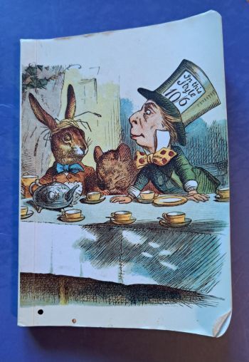 Cover of my reading log book featuring Tenniel illustration of the Mad Hatter's Tea Party