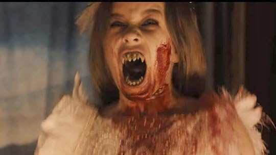 image of a child vampire showing teeth with blood on her face Abigail trailer