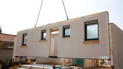 Modular home being assembled at a construction site