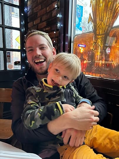 a man holding a child