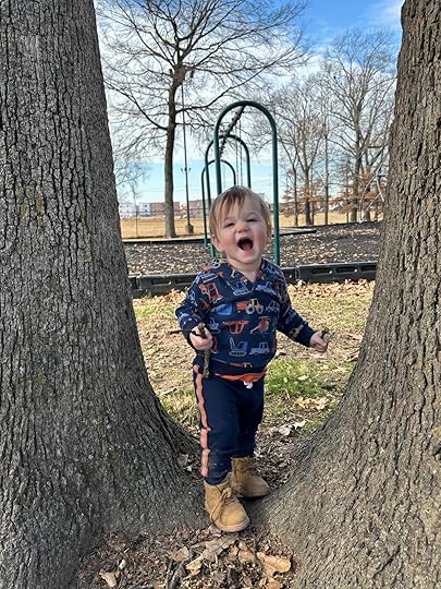 a baby standing in a tree