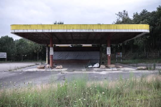 The remaining rusted out shell of what used to be a gas station.