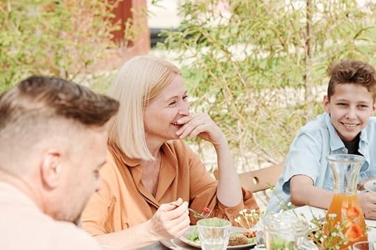 A family having a conversation. Mastering dialogue is one of the key strategies for writing strong family dynamics.