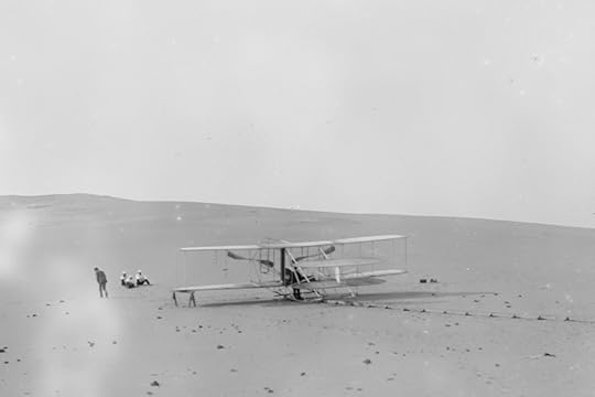 The remodeled 1905 Wright machine, altered to allow the operator to assume a sitting position and to provide a seat for a passenger, on the launching track at Kill Devil Hills.