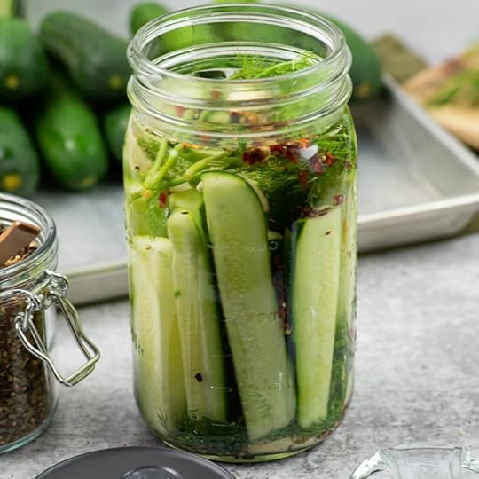 Fermenting pickles in a wide mouth mason jar.