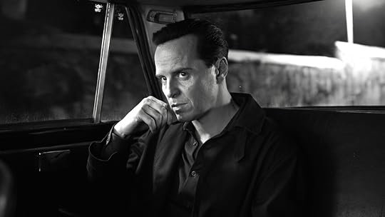 Andrew Scott with his hand on his chin in a car in the black-and-white Ripley series from Netflix
