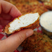 close up of chicken strip cut to reveal tender meat.