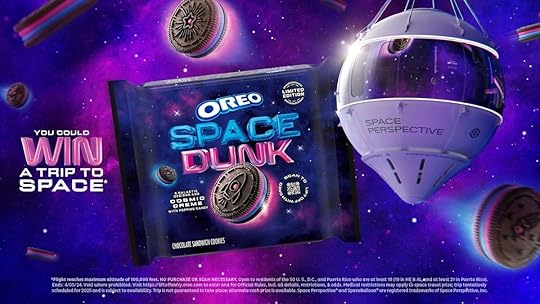 A blue and pink box of Oreo Space Dunk cookies on a purple background next to cookies and a space baloon