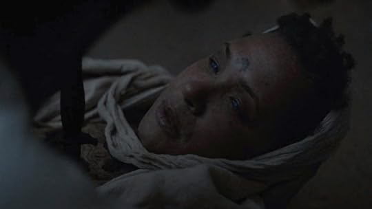 A woman in a hooded robe lies dead with a knife in her heart in Dune