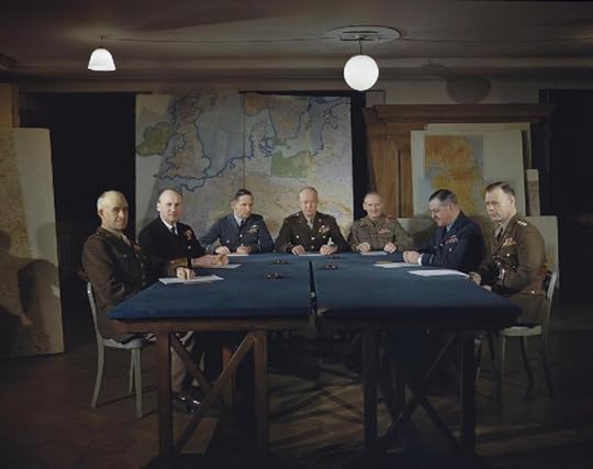 Gen. Omar Bradley, Adm. Bertram Ramsay, Air Chief Marshal Arthur Tedder, Gen. Dwight Eisenhower, Gen. Bernard Montgomery, Air Chief Marshal Trafford Leigh-Mallory, and Gen. Walter Bedell Smith at a SHAEF conference in London, England, 1 Feb 1944 (Imperial War Museum TR 1541)