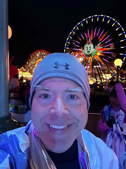 The author at the end of his race, standing in a selfie photo in front of the Sun Wheel at Disney's California Adventure.