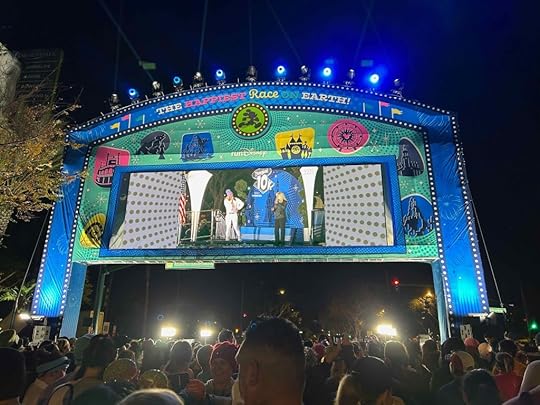 A colorful archway with embedded television monitor that serves as the starting line for the 10K.