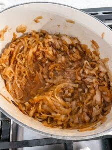 The onions completely softened, browned, and releasing liquid