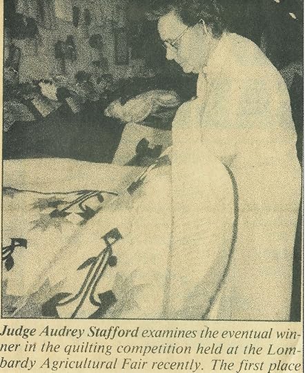 Audry Stafford judging a quilt