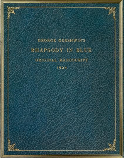 A blue leather-bound volume, with gold trim and gold writing.